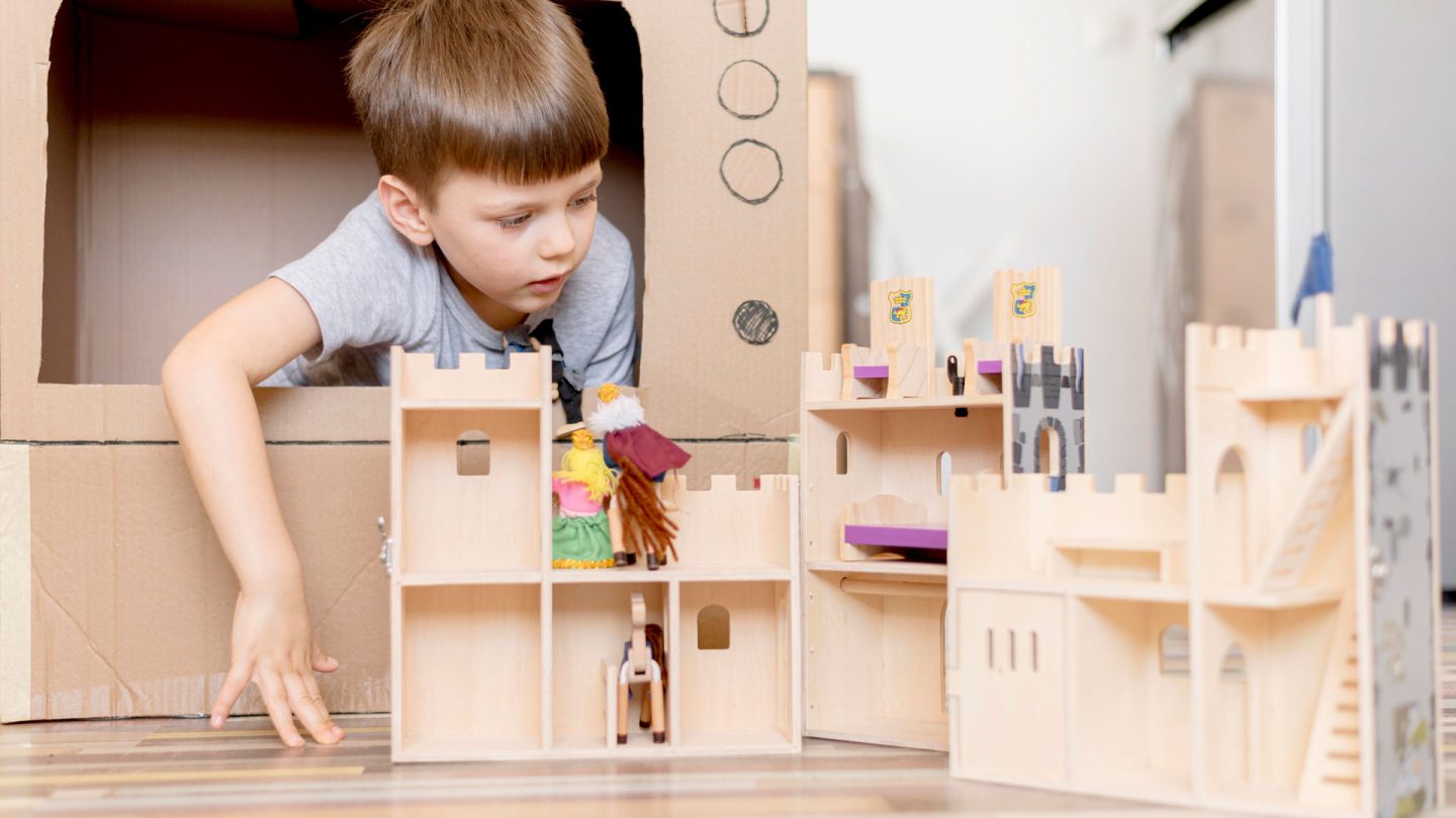 little-boy-with-wooden-castle