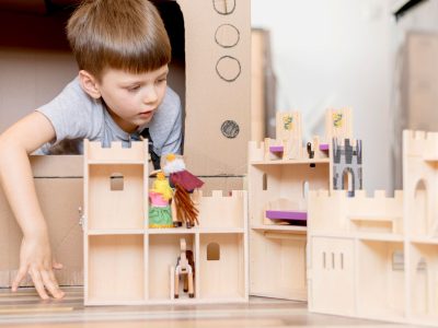 little-boy-with-wooden-castle