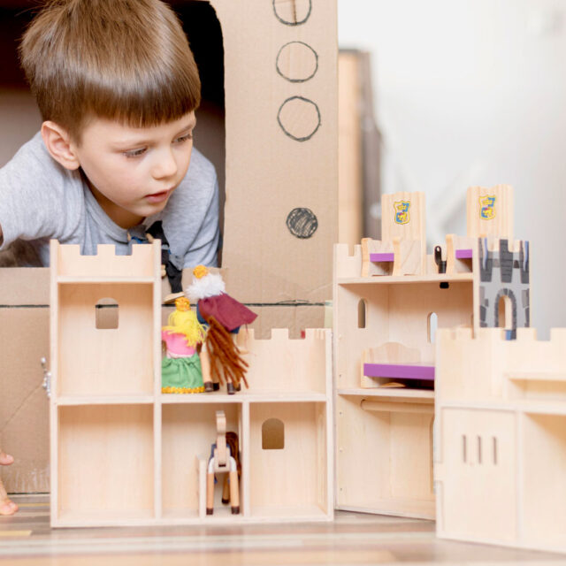 little-boy-with-wooden-castle